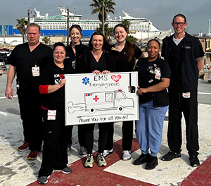 Galveston staff holds thank-you sign