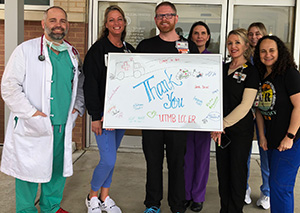 League City staff holds thank-you sign