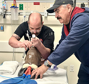 Two medics practice emergency process