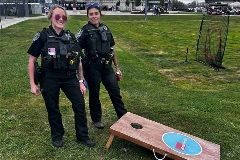 officers posing at youth baseball event