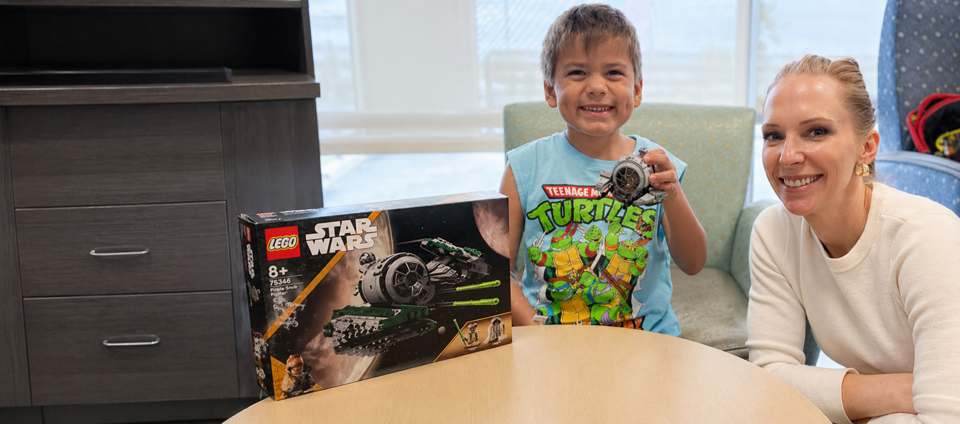 Child playing with legos during a gene therapy appointment at UTMB Health.
