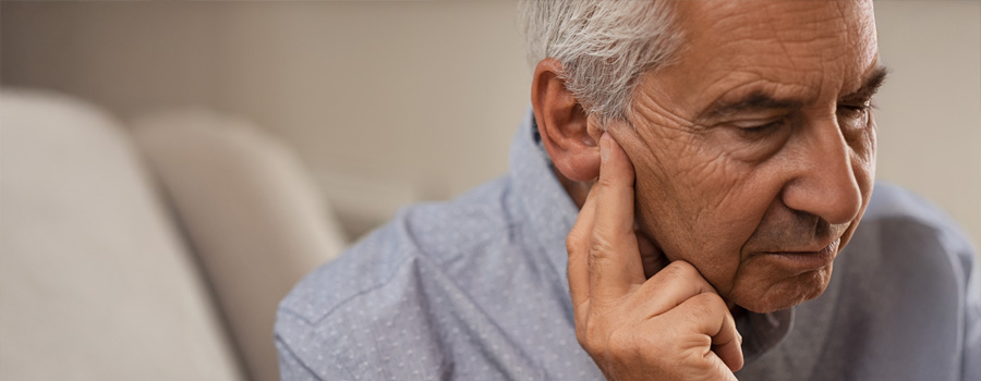 Senior man with hearing problems 