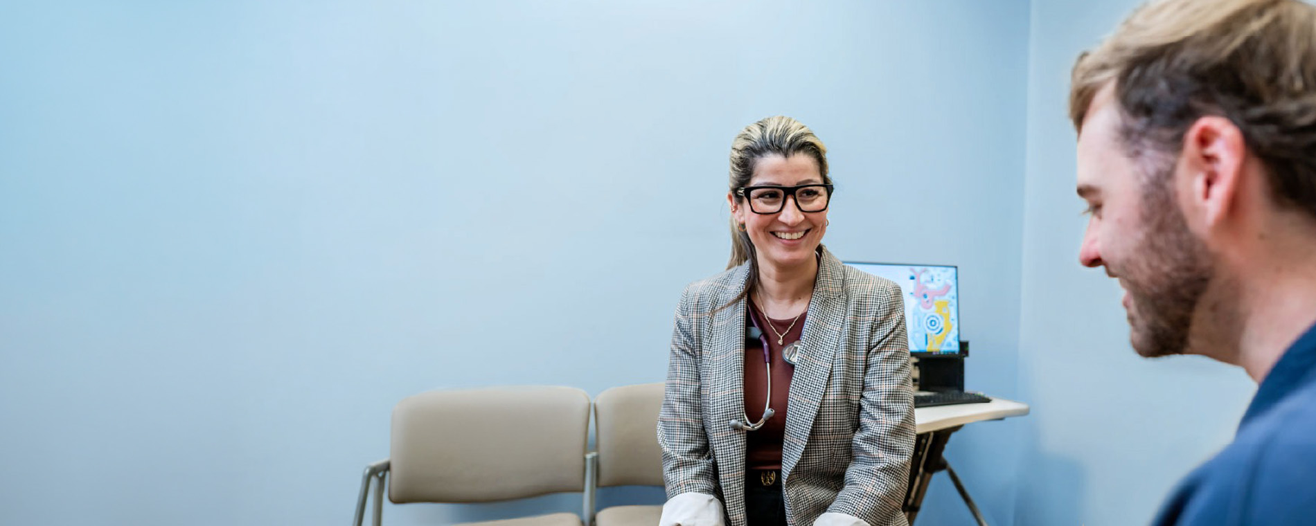 Doctor discussing digestive health with patient.