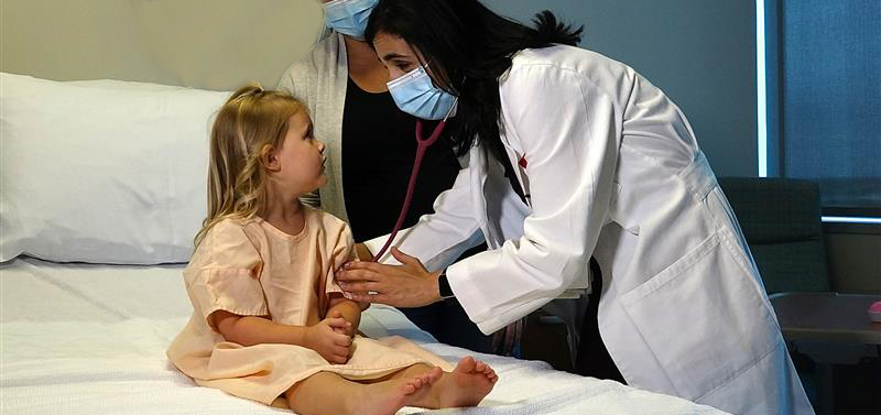 doctor with young child in hospital