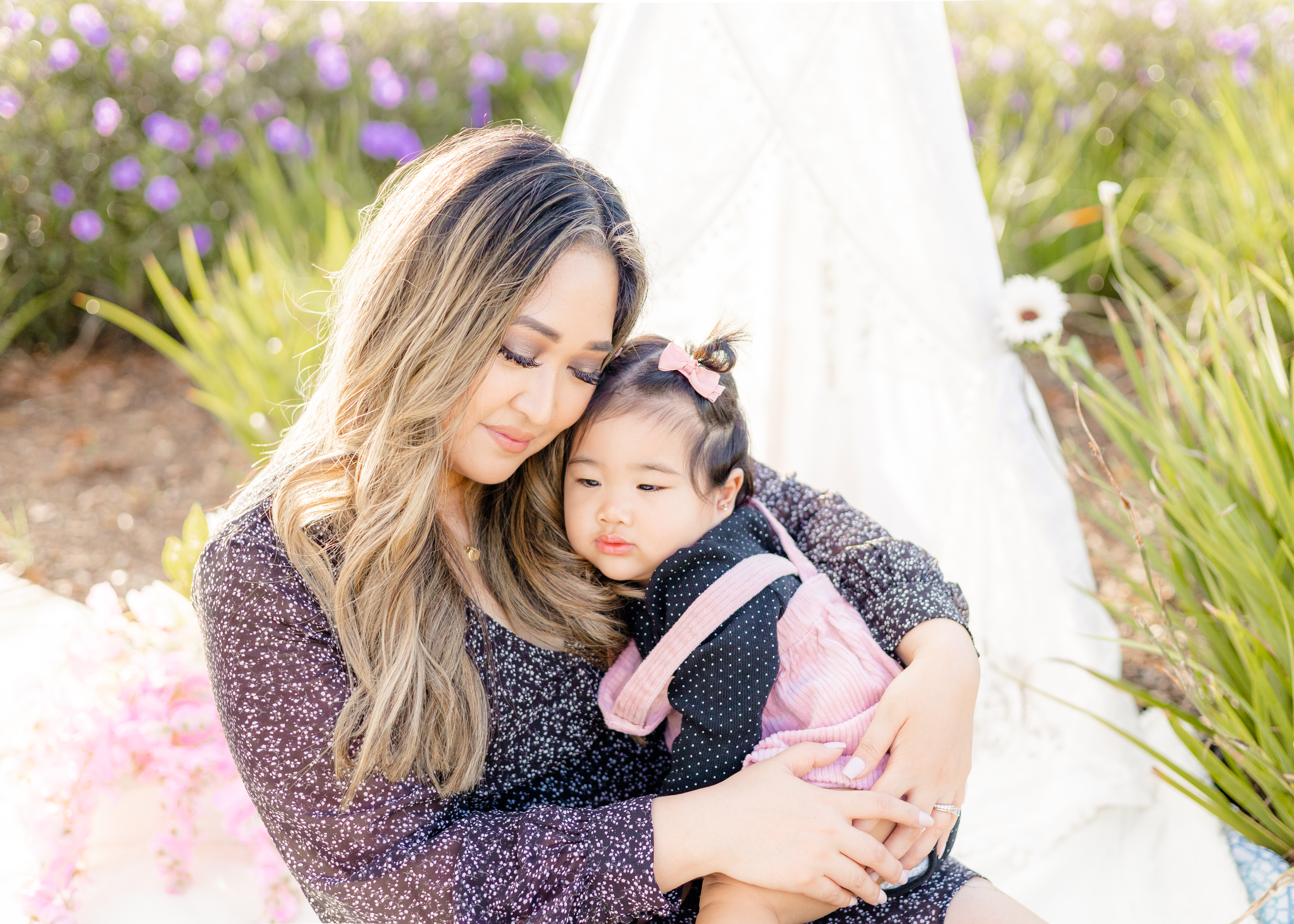 mother and daughter embracing outside