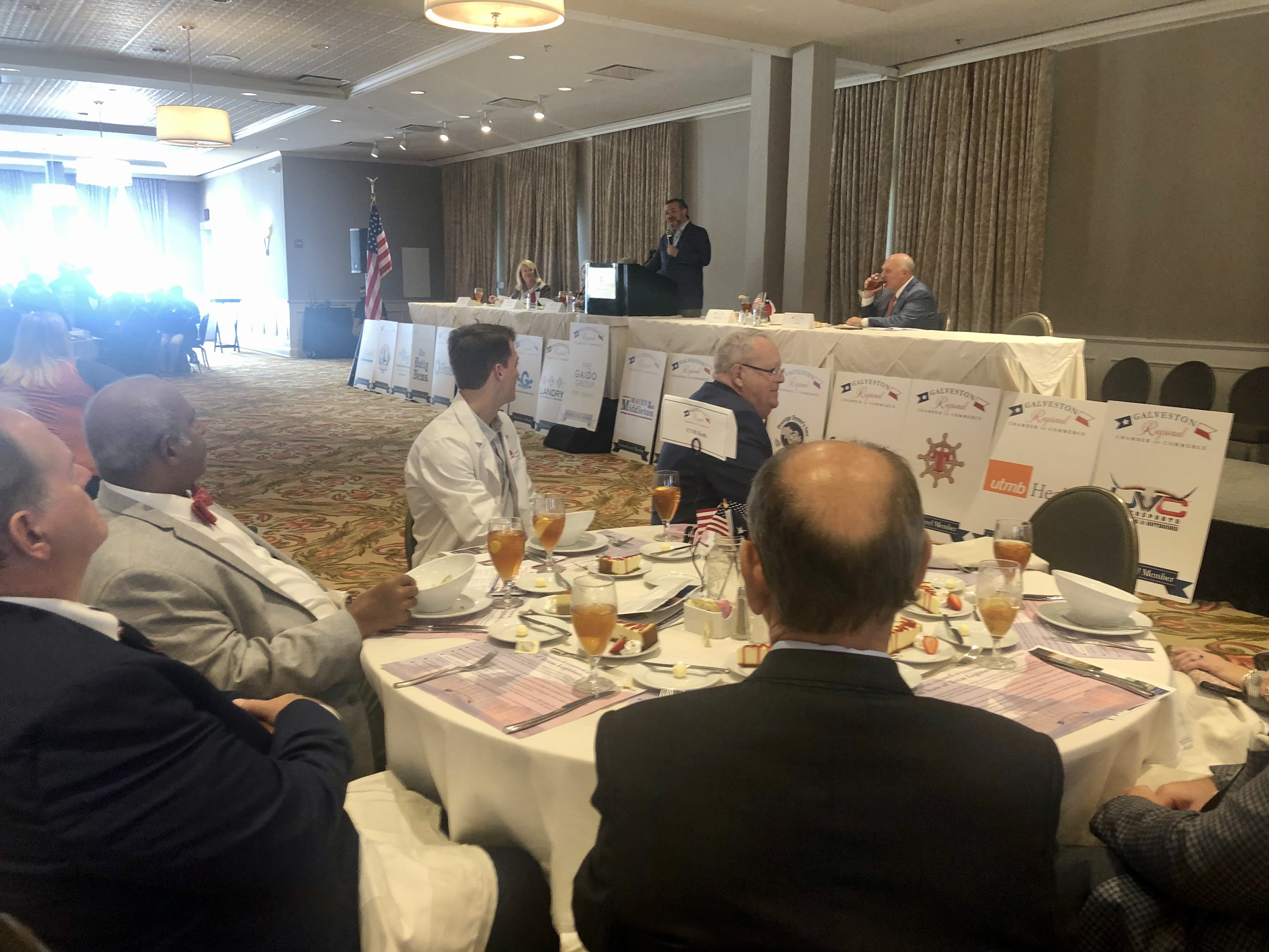 photo of utmb health table at legislative luncheon with sen. ted cruz