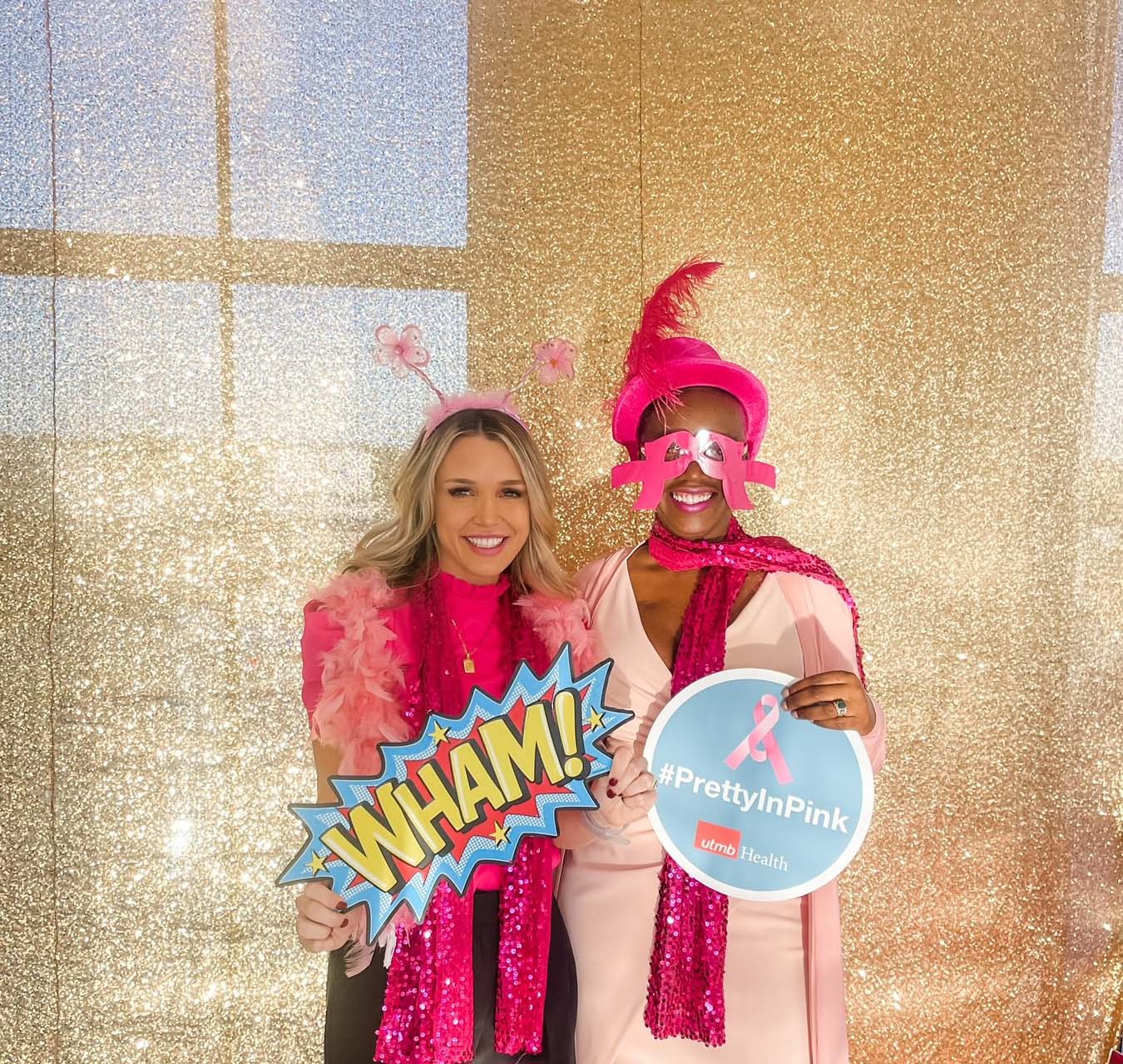 Image of Jill Resendez and Tina Herring in front of gold back drop during the 2022 BRA Day event on the League City Campus