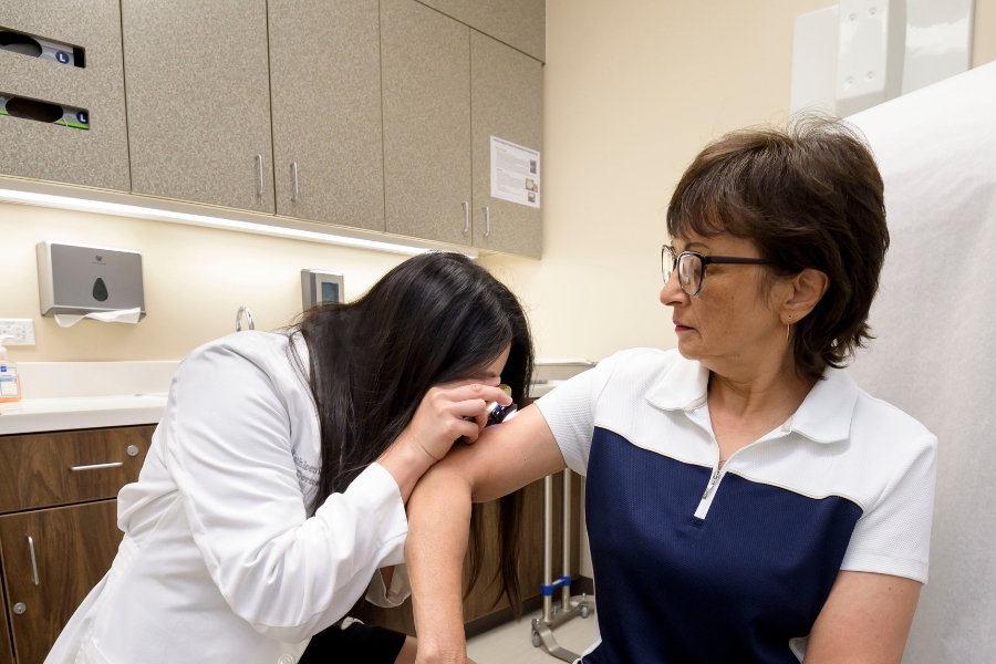 doctor inspects a patient skin