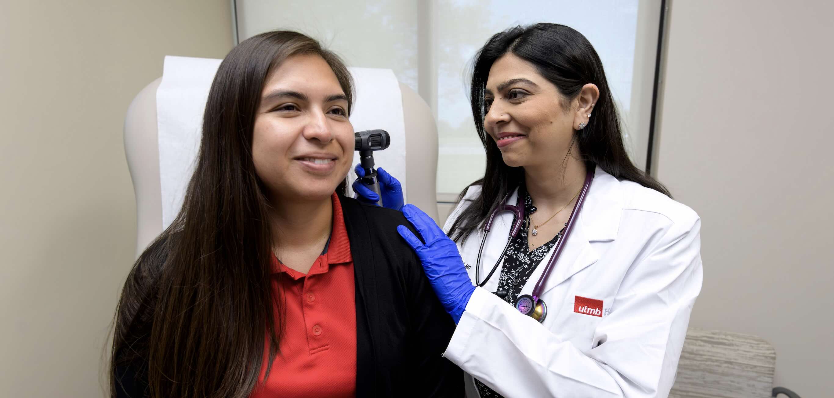 Doctor looking in patients ear