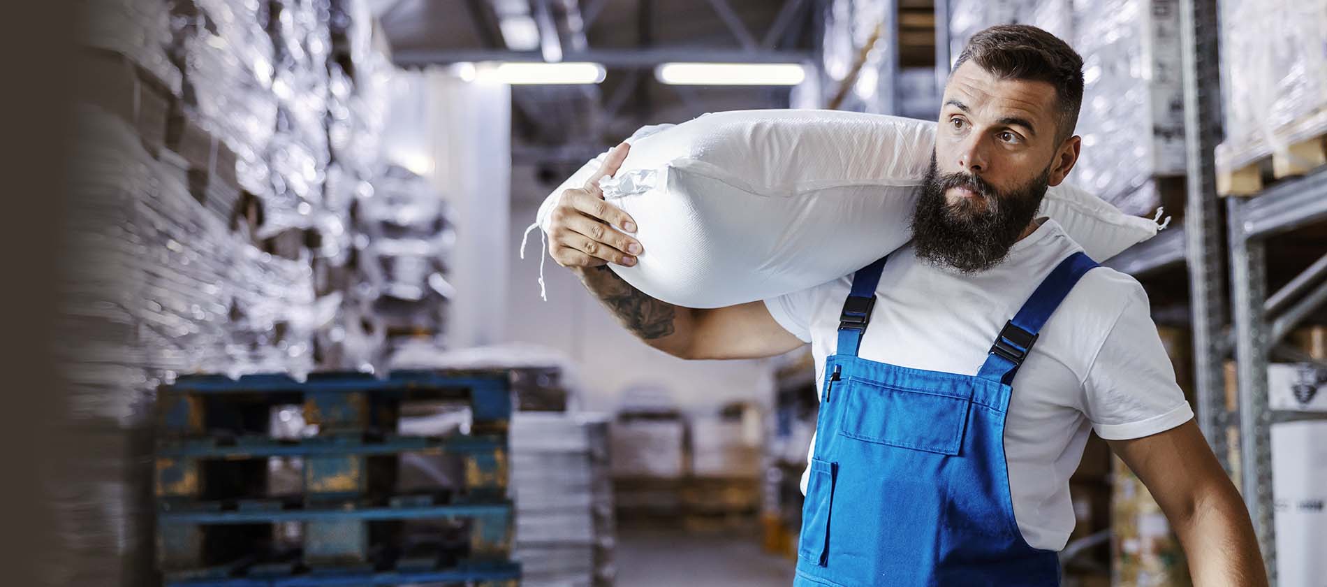 man carrying heave sack