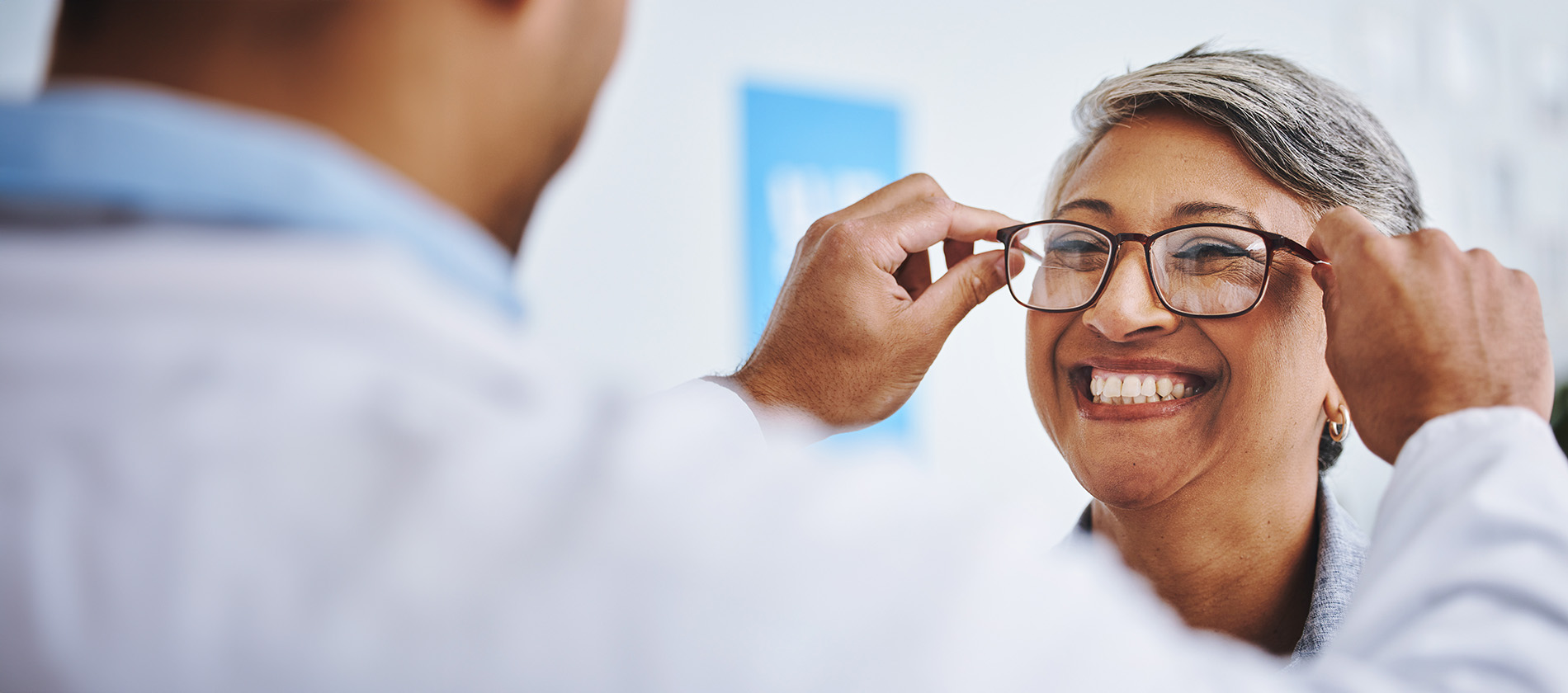 A close-up of an older woman's eye, highlighting signs of age-related vision changes and cataracts.