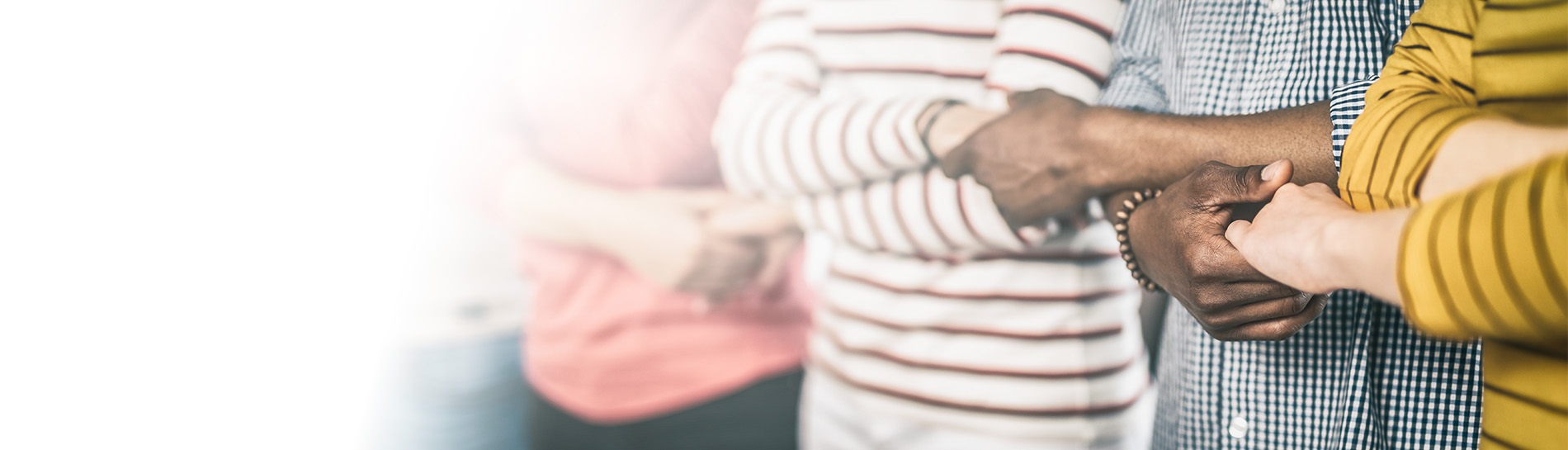 Group of people holding hands