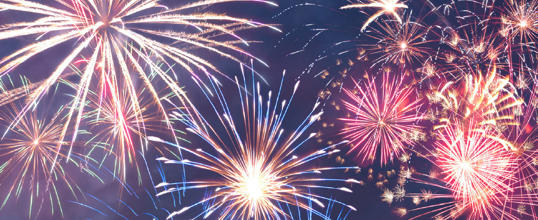 Fireworks exploding across a night sky
