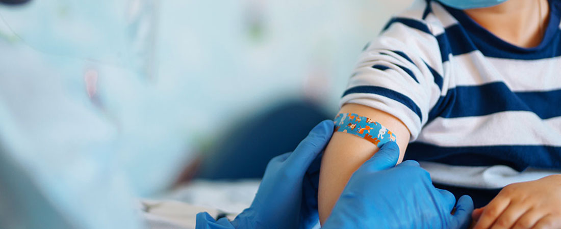 close up of child arm with bandage