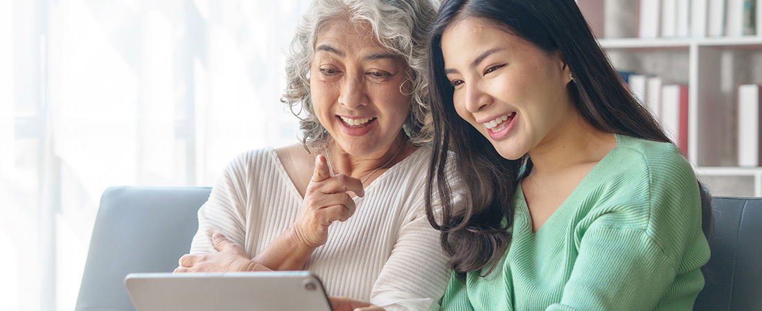 Mom and daughter looking at laptop