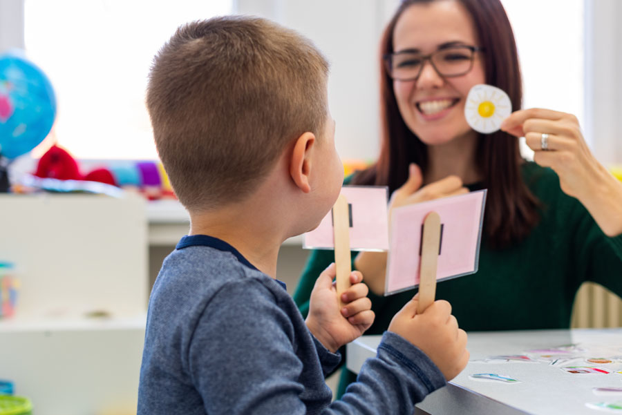Speech therapist working with a child