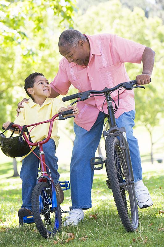 Grandpa and grandson riding bikes