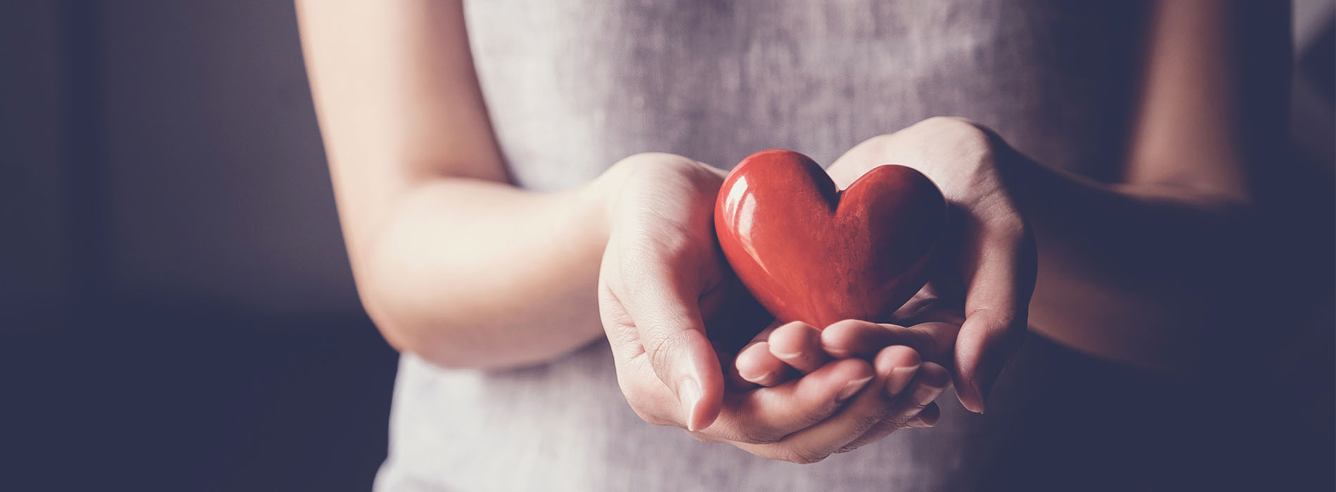 woman holding a heart