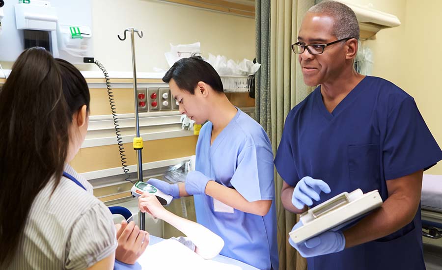 UTMB medical team working on patient in emergency room