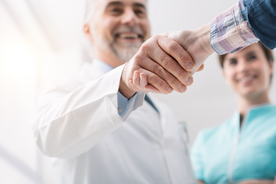 Doctor and patient shaking hands