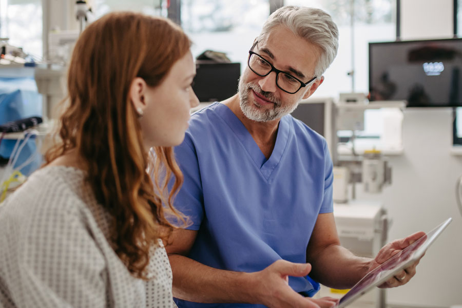 A neurologist reviews care options with a patient during an epilepsy consultation at UTMB Health.