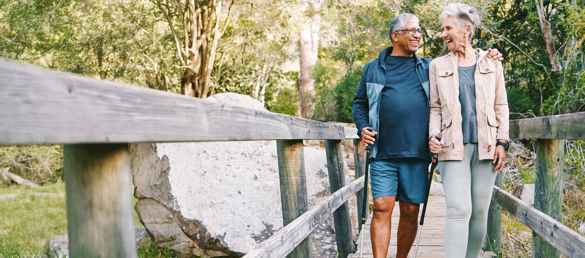 Two older adults walk outdoors together, reflecting mobility, independence, and improved quality of life after chronic pain care.