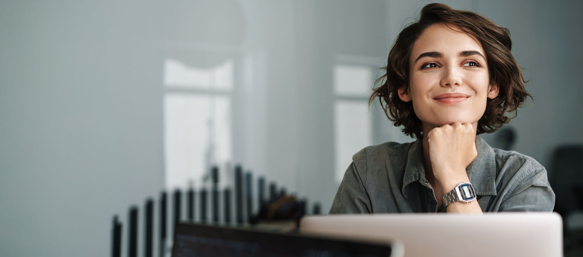 A patient sits comfortably and confidently, reflecting improved quality of life after spine and nerve care at UTMB Health.