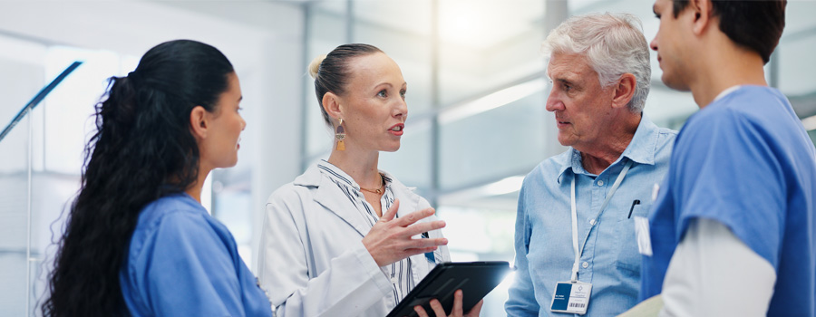 A neurosurgery care team discusses imaging and treatment planning for neurovascular and stroke conditions at UTMB Health.