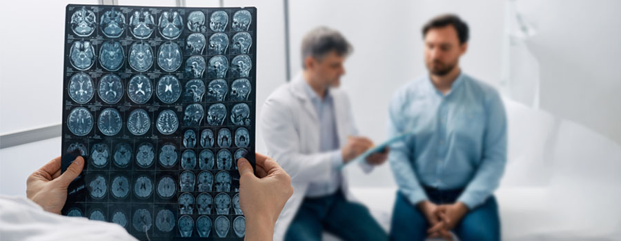A provider reviews detailed brain imaging to support diagnosis and treatment of neurovascular conditions at UTMB Health.