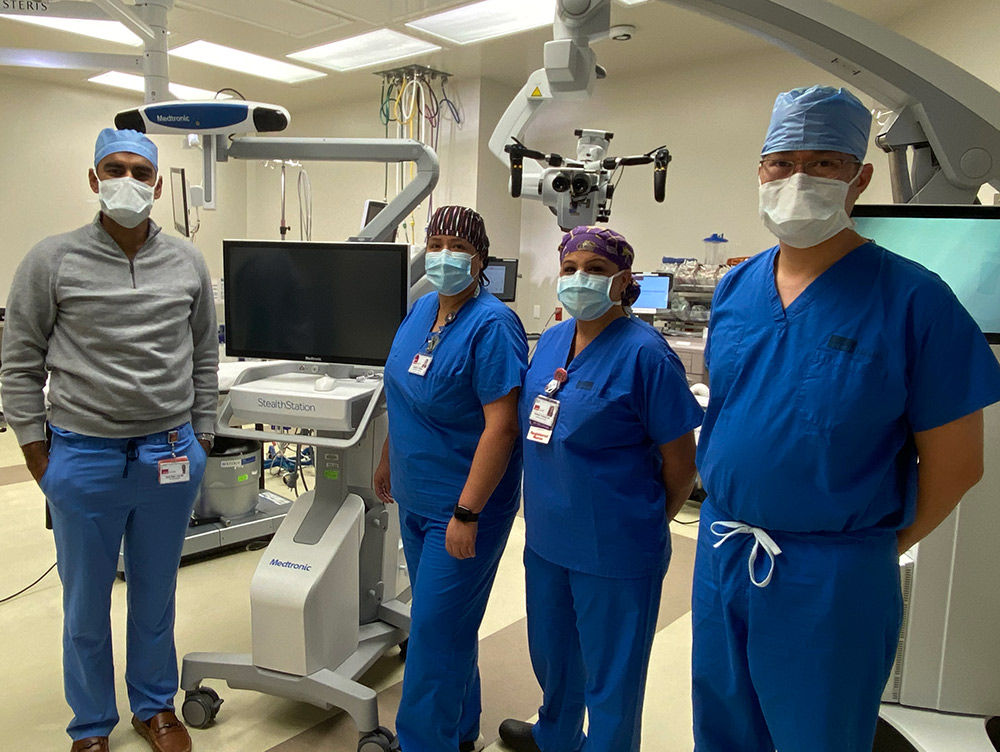 Patient care teams at UTMB Health’s Clear Lake Campus recently conducted the first craniotomy and aneurysm clipping procedure at the hospital. Some members of the teams that performed the procedures are, from left, Dr. Rishi Lall, director of UTMB’s Neurosurgery Spine program; Annabelli Toledano, surgical technologist in the surgical operating suite; Christine Fontenot, operating room nurse, and Dr. Peter Kan, chair of UTMB’s Department of Neurosurgery. CLC Neurosurg