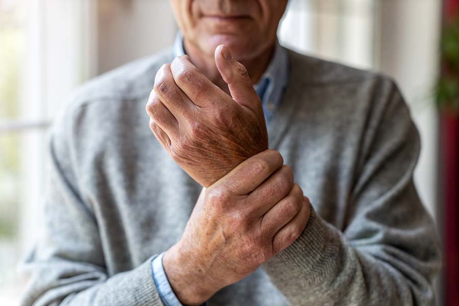 Man holding wrist