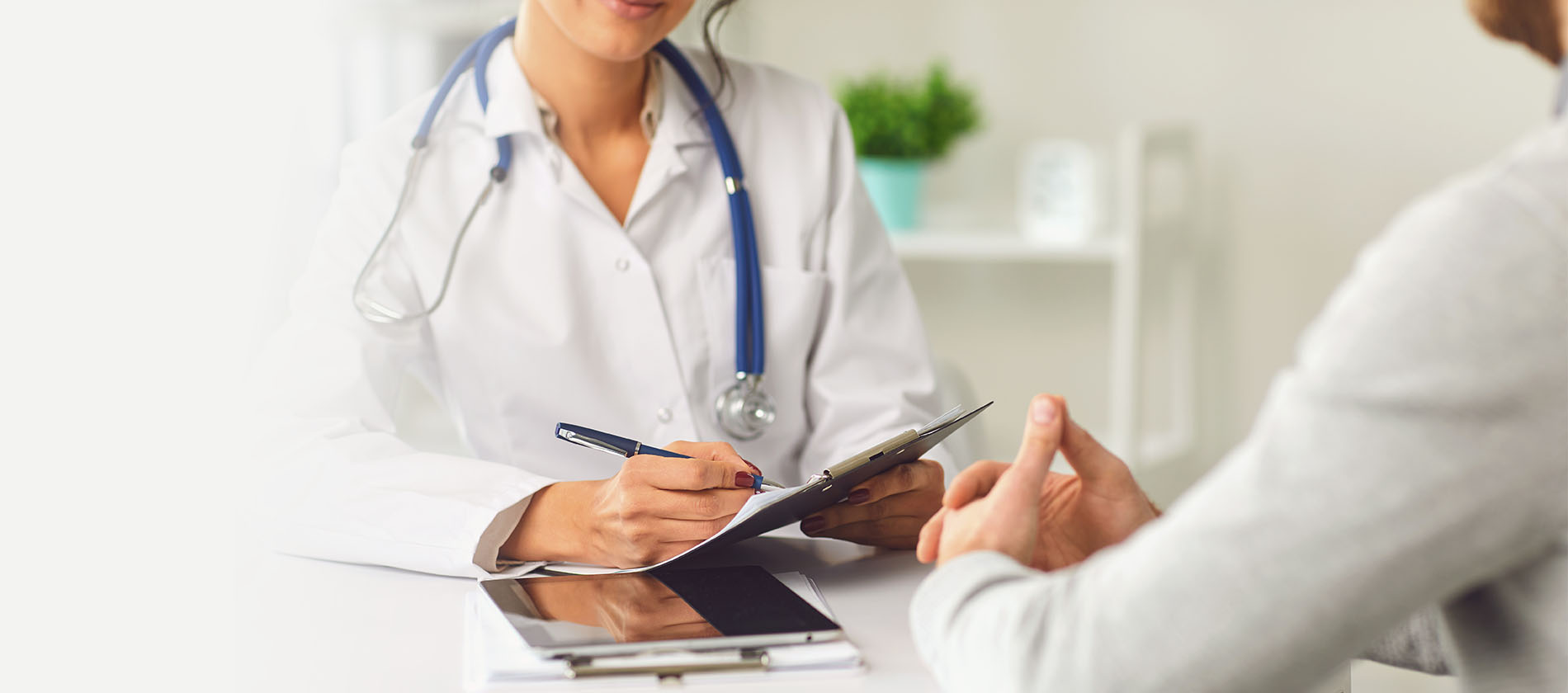 doctor examining kidneys with stethoscope