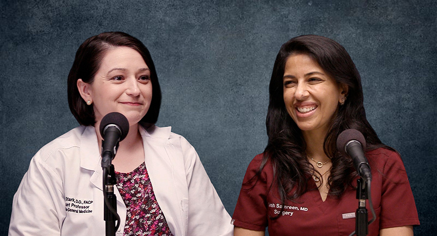 Two adults seated at microphones in a studio setting, one wearing a white lab coat and the other wearing scrubs, speaking during a recorded conversation against a dark textured background