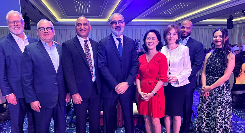Seven UTMB Health leaders and representatives pose in a ballroom at the 2026 Vizient Connections Summit in Las Vegas, where Vizient recognized top-performing health systems and hospitals.