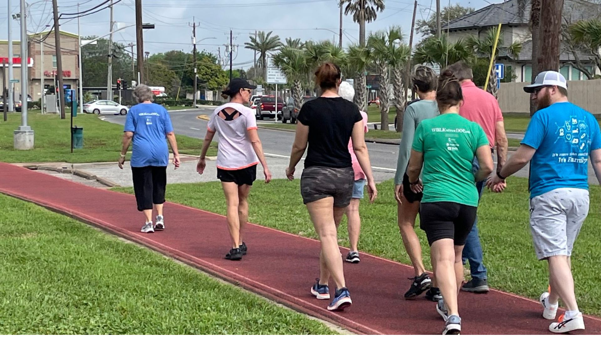 A group of men and women walking on a track