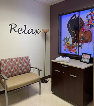 Prepping for a mammogram can be a mentally daunting task, that’s why the Women’s Comprehensive Care clinic directory Dr. Tonya Callender has been extra intentional about the changing rooms patients use before and after those visits. From the ‘Relax’ decal on the wall to the hand-picked art, Callender wants her patients to feel calm and comforted. Changing room at womens clinic