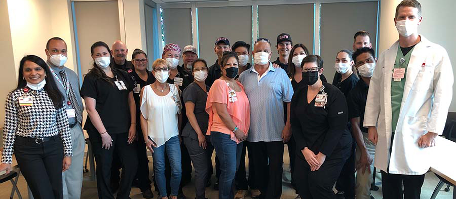 Group photo of CLC ER team and patient