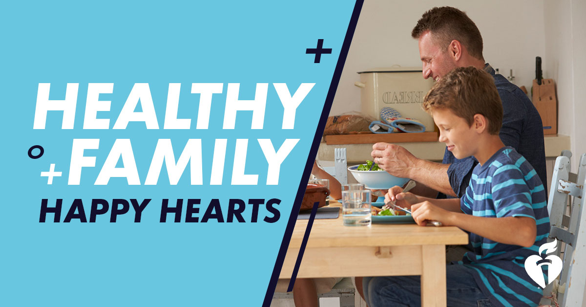 healthy family, happy hearts - dad and son eating a meal together