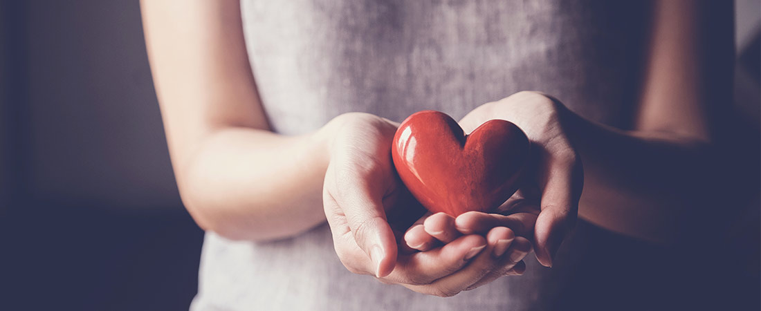 woman holding a heart