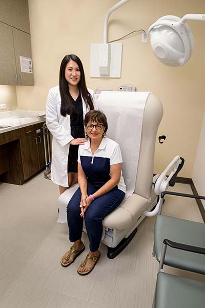 UTMB Health Dermatologist Dr.Kathleen Kroger with her patient Cynthia Wong, a skin cancer survivor. Dr. Kroger with Patient