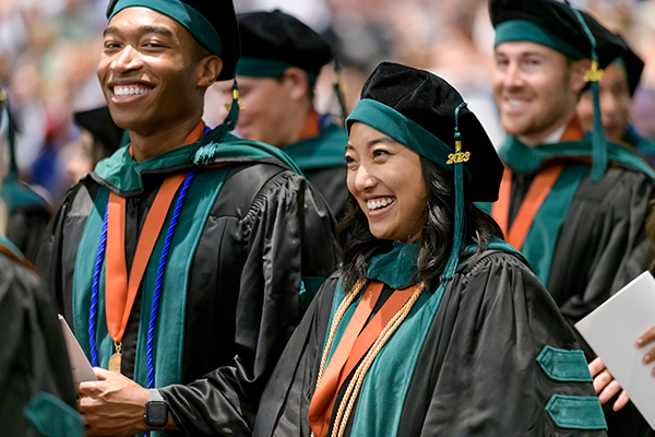 UTMB School of Medicine graduates in commencement regalia